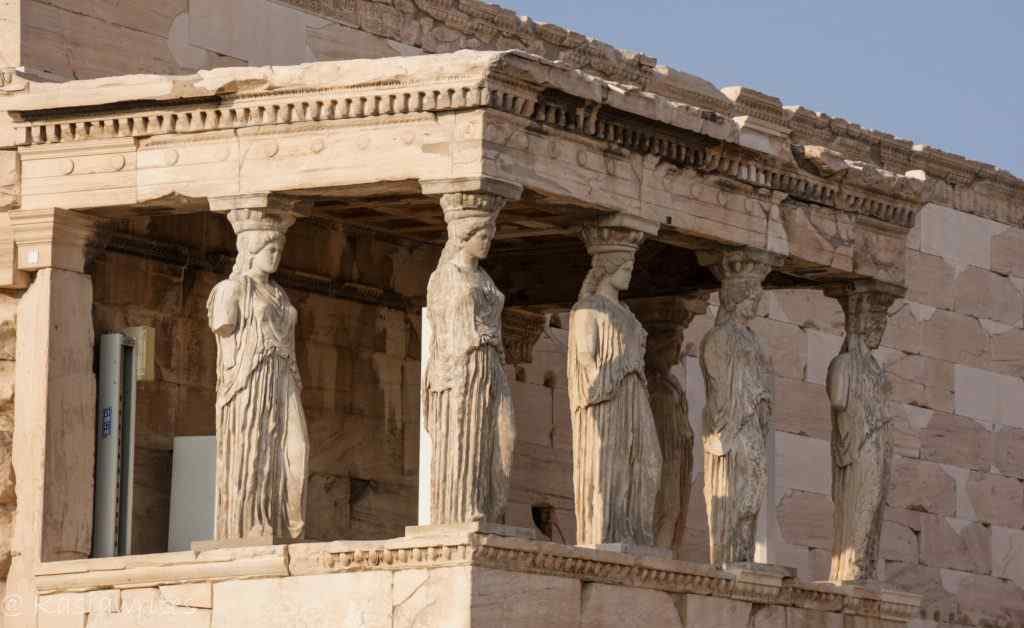 women figures at the Parthenon in Athens