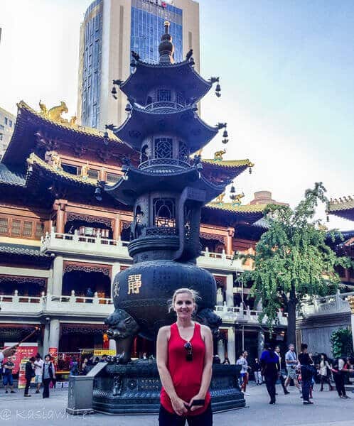 woman in red top in chinese temple courtyard