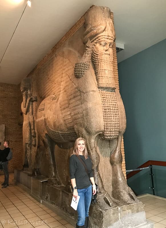 About Kasia Writes travel blog - kasia beside an ancient exhibit at the British Museum