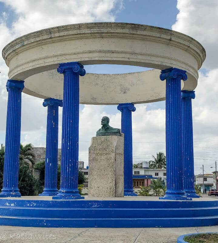 blue columns surrounding a bust