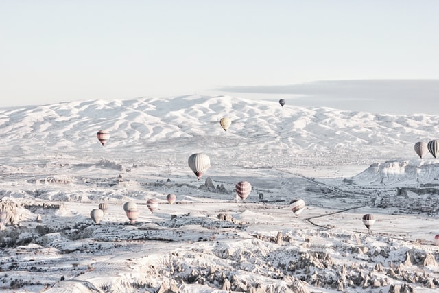 Hot air balloons flying over Cappadocia in winter