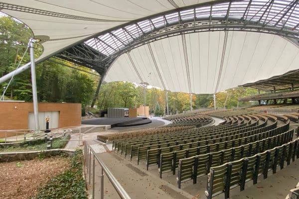 View of the stage and seating area under a roof at the Forst Opera in Sopot